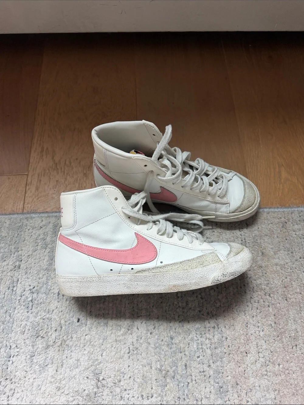 Nike High-Top Sneakers in White with Pink Swoosh